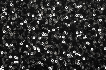 Black background with shiny silver sequins
