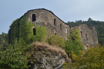 Phantasmagoric Abandoned Building Of Medieval Style Next To The River Suarna In Navia De Suarna. Nature, Architecture, History, Street Photography. August 23, 2014. Navia De Suarna, Lugo, Spain.