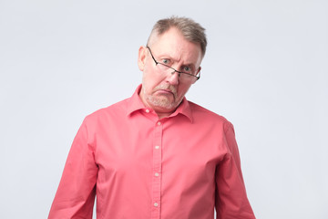 Obraz premium Elderly man upset and distressed by pension