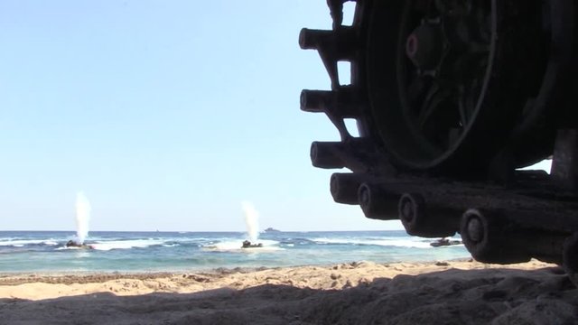 Amphibious vehicles AAV 7A1 firing explosives
