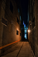 Fototapeta na wymiar Scary and dark urban city alley at night in Chicago