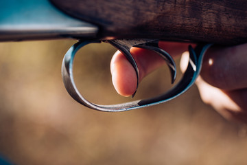 Hunter with shotgun gun on hunt. Poacher with Rifle Spotting Some Deers. Pulled the trigger of the...