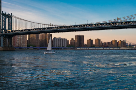 View of the Brooklyn bridge during a dusk from East river. New York City