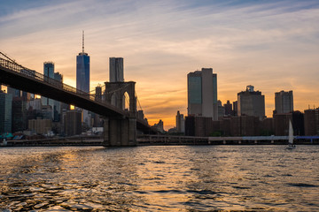 Naklejka na ściany i meble View of the Brooklyn bridge during a dusk from East river. New York City