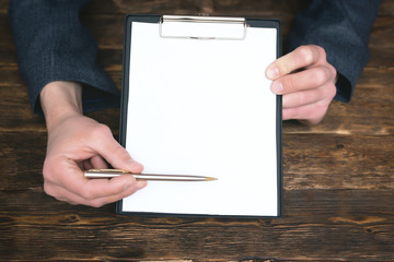 Agreement or business contract template. To do list mock up. Blank paper sheet. Businessman is...