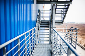 Metal technical steps on the building