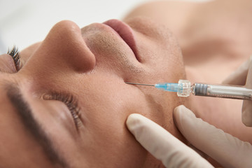 Close up young man on rejuvenate procedure