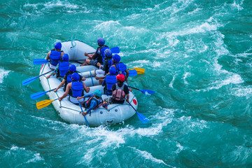 adventure water sports, white water rafting in River Ganges Rishikesh India. Raft in action image   - obrazy, fototapety, plakaty