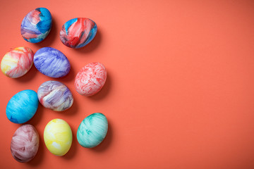 Easter eggs on a Living Coral background. 2019. Easter ideas. Easter eggs. Space for text. Happy easter.