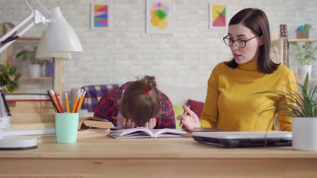 Mother scolds her daughter for bad studies