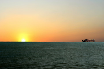 Fototapeta premium a beautiful sunrise appears on the high seas