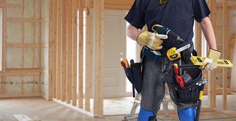 Builder handyman with drill tools.