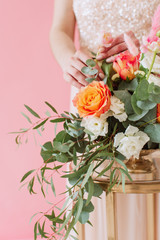 Delicate floral bouquet of spring flowers on pink background