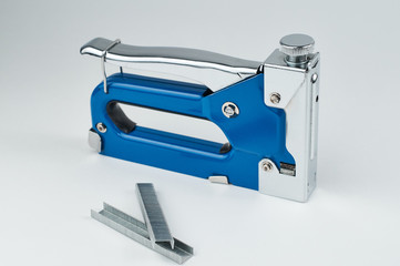 furniture stapler on white background