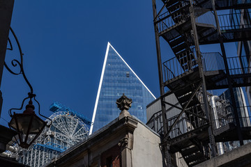 Fire escape stairs at front glass  structure.