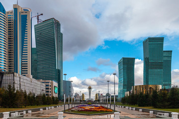 Fototapeta na wymiar Nurzhol boulevard, view to Bayterek Tower and Temir Zholy Tower and Emerald Quarter, Nur-Sultan, Astana; Kazakhstan