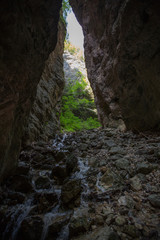 Canyon in the via ferrata burrone Giovanelly. Small river flowing in a tight canyon in Trentino