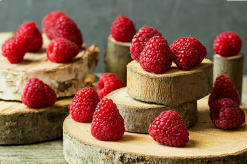 Fresh raspberry berries on stumps.