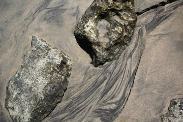 Sand texture from receiding water on a tropical beach