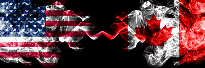 United States of America vs Canada, Canadian smoky mystic flags placed side by side. Thick colored silky smoke flags of America and Canada, Canadian