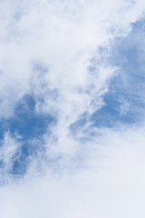 Wispy white clouds against a blue sky as a nature background