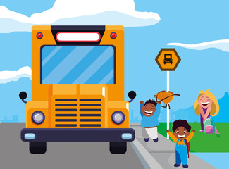happy little interracial school kids in the bus stop