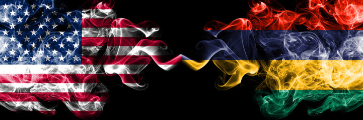 United States of America vs Mauritius, Mauritian smoky mystic flags placed side by side. Thick colored silky smoke flags of America and Mauritius, Mauritian