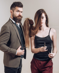 Barber shop tools on gray background. Bearded man anm woman with long hair. Barber shop design. Vintage barber shop. Razor sharp. Barbershop. Barber scissors.