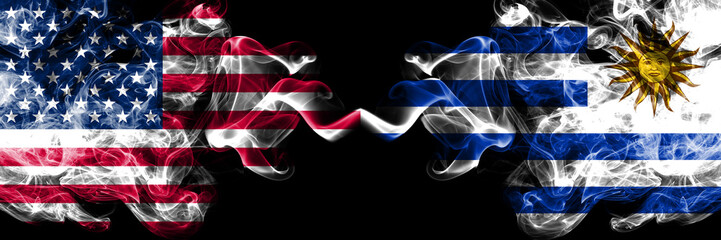 United States of America vs Uruguay, Uruguayan smoky mystic flags placed side by side. Thick colored silky smoke flags of America and Uruguay, Uruguayan