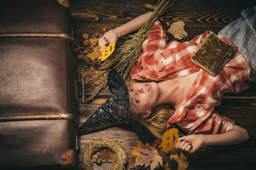 Happy young woman in witch halloween costume on party over isolated background Wide Halloween party...