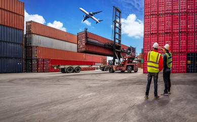 Foreman control loading Containers box to truck for Logistic Import Export Background, Business logistic concept, import and export concept.