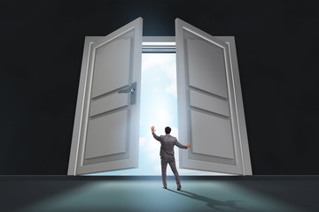 Fototapeta premium Businessman entering big large door