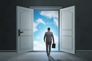 Fototapeta premium Businessman entering big large door