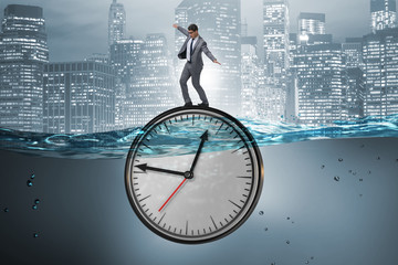 Businessman in deadline and time management concept