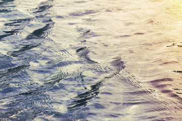 water surface being rippled and waved by strong wind during sunset. For background or wallpaper