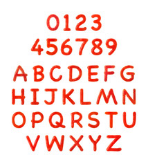 Creative alphabet and numbers made of tomato sauce on white background