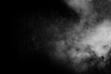 abstract white smoke powder explosion on black background