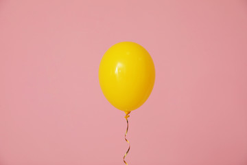 Bright balloon on color background. Celebration time