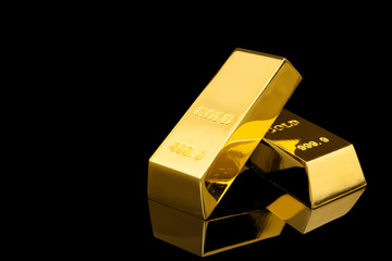 Shiny gold bars on black background. Space for text