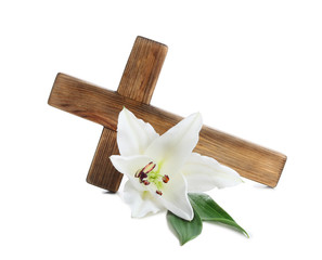 Wooden cross and blossom lily on white background