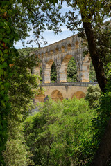 Fototapeta na wymiar The magnificent three tiered Pont Du Gard aqueduct was constructed by Roman engineers in the 1st century AD in the south of France