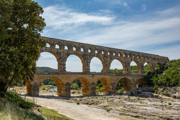 Fototapeta premium The magnificent three tiered Pont Du Gard aqueduct was constructed by Roman engineers in the 1st century AD in the south of France