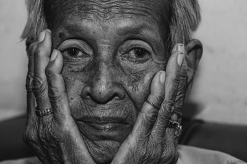 The old woman's felling lonely.(dementia and Alzheimer’s disease)