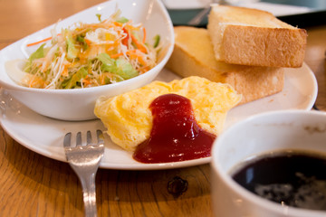 Omelette/salad/bread and coffee - moment of breakfast at cafe in the morning in Tokyo, Japan
