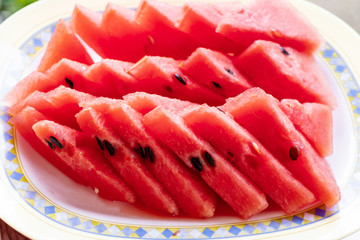 Tasty sliced watermelon in a dish.