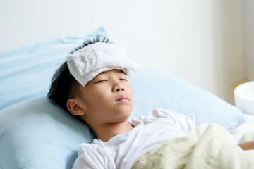 Young boy sick and sleep on the bed