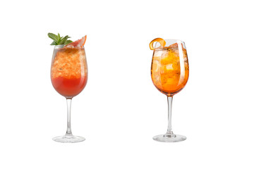 Alcohol cocktail with mint, fruit and berries on a white background. A set of two cocktails in glass goblets on a long leg.