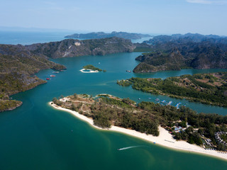 Fototapeta na wymiar Aerial view of Kilim Geoforest Park. There is sea, river, coastline, mangroves and mountains on the photo. Langkawi, Malaysia.