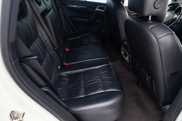 View to the interior of car with rear leather seats after cleaning before sale on parking