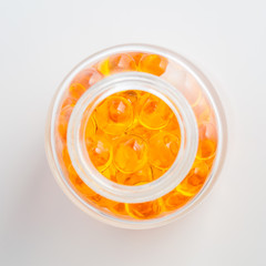 Yellow pills tablet on a white background.